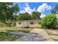 Inviting single-story home with a well-lit entry and a spacious front yard at 956 Osceola Trl, Casselberry, FL 32707