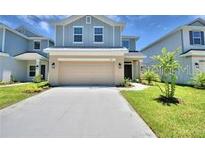 Charming two-story home with a well-maintained lawn and inviting curb appeal at 1476 Leamington Lane, Winter Haven, FL 33884