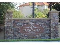 Tuscana condo community entrance with stone pillars and signage at 1371 Tuscan Ter # 3403, Davenport, FL 33896