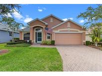 Attractive single-story house with a two-car garage and well-maintained lawn at 4068 Carteret Dr, Winter Haven, FL 33884