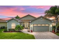 Attractive single-story home with a two-car garage and landscaped yard at 4489 Strathmore Dr, Lake Wales, FL 33859