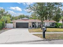 Charming single-story home with stone accents and a spacious driveway at 5406 Winfree Dr, Orlando, FL 32812