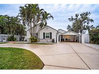 Charming single-story home with a covered carport and landscaped lawn at 524 Arneson Ave, Auburndale, FL 33823