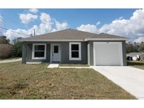 Charming single-story home featuring a one-car garage and well-maintained front yard at 809 Lincoln St, Babson Park, FL 33827