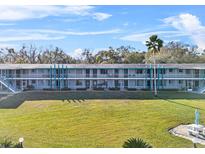 Condo building with pool and lake view at 1600 W Lake Parker Dr # C25, Lakeland, FL 33805
