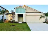 Charming single-Gathering home with a well-manicured lawn and a two-car garage at 1397 Axel Cir, Winter Haven, FL 33880