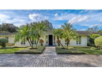 Charming home featuring professional landscaping and a beautiful paved driveway and entryway at 2300 N Scenic Hwy # 89, Lake Wales, FL 33898