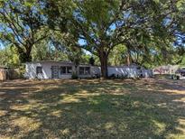 Charming single-story home with a well-kept lawn and mature shade trees in a peaceful residential neighborhood at 5402 Parkway Drive, Belle Isle, FL 32809