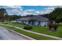 Charming single-story home with well-manicured lawn and inviting curb appeal at 217 Kent Ct, Haines City, FL 33844