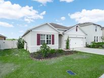 Charming single-story home with well-manicured lawn and inviting curb appeal at 3862 Whitney Way, Haines City, FL 33844
