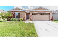 Charming single-story home with well-maintained lawn and tropical landscaping at 249 Haines Blvd, Winter Haven, FL 33881