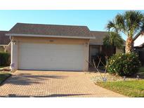 Charming single-Gathering home with brick driveway and lush landscaping at 4007 Cypress Lndg S, Winter Haven, FL 33884