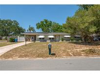 Charming single-story home with a well-maintained lawn and a welcoming front entrance at 703 Osceola Ave, Lake Wales, FL 33853