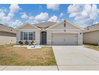 Charming single-story home with a well-maintained lawn and inviting curb appeal at 180 Grove Branch Rd, Winter Haven, FL 33880