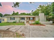 Charming single-story home with light brick, manicured landscaping, and a spacious front yard at 1919 19Th Nw St, Winter Haven, FL 33881