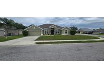 Charming single-story home with well-maintained lawn and neutral exterior paint at 1400 Eagle Crest Blvd, Winter Haven, FL 33881