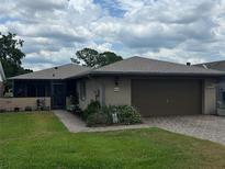 Charming single-story home featuring a well-maintained lawn and attached garage, great curb appeal at 426 Gleneagles Ct, Winter Haven, FL 33884