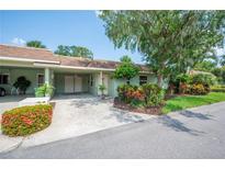 Charming home with a well-manicured lawn and lush landscaping, creating a welcoming curb appeal at 2202 Starboard, Winter Haven, FL 33881
