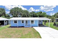 Charming single-story home with a carport and well-maintained front yard at 4859 Foxwood Blvd, Lakeland, FL 33810