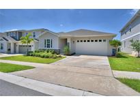 Charming single-story home with manicured lawn and a two-car garage at 1100 Sugarwood St, Davenport, FL 33837