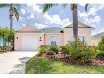 Charming single Gathering home in a lush landscaped yard with a garage at 263 Reserve Dr, Davenport, FL 33896