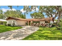 Charming single-story home with lush front lawn and inviting curb appeal at 527 Duchess Dr, Lakeland, FL 33803