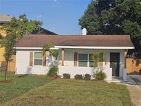 Charming single-story home featuring a brick facade, cozy front yard, and refreshed landscaping at 631 Julia Se St, Winter Haven, FL 33880