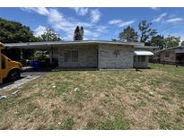 Charming single-story home with a covered carport and classic brick facade at 507 Avenue H Se, Winter Haven, FL 33880