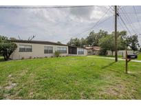 Inviting single-story home with a well-manicured lawn and traditional mailbox at 455 Manor Dr, Bartow, FL 33830