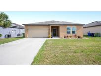 Well-maintained front yard featuring a lush lawn and tidy landscaping at 4662 Osprey Way, Winter Haven, FL 33881