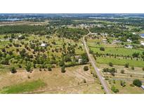 Spacious property featuring mature trees and multiple building locations at 836 S Lake Starr Blvd, Lake Wales, FL 33898