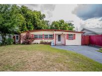Charming single-story home features a cozy front yard and classic architectural details at 919 Timor Ave, Orlando, FL 32804