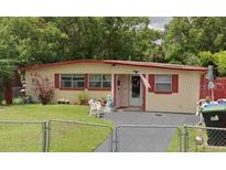 Charming single-story home featuring a well-maintained front yard and cozy curb appeal at 919 Timor Ave, Orlando, FL 32804