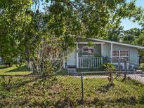 Charming single-story home with a fenced yard and mature trees in a quiet neighborhood at 2403 Nansen Ave, Orlando, FL 32817