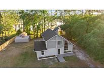 Stunning home exterior featuring a new roof and lush green surroundings at 2449 E Lake Dr, Deland, FL 32724
