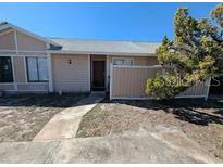 Charming single-story home with neutral siding and well-maintained landscaping at 2910 Western Willow Ter, Orlando, FL 32808