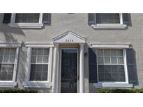 Home's front entrance with a white trim, sidelights, and a decorative transom with house number at 3654 Peppervine Dr, Orlando, FL 32828