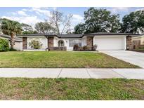 Charming single Gathering home with a well-manicured front yard and stone accents at 1928 South Blvd, Maitland, FL 32751