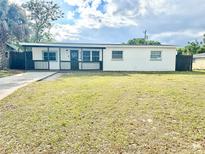 Charming single-story home featuring a covered front porch and a well-maintained lawn at 2336 Nansen Ave, Orlando, FL 32817