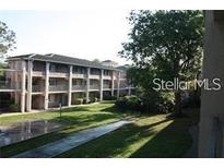 Multi-story building with well-maintained landscaping and exterior walkways at 125 Water Front Way # 200, Altamonte Springs, FL 32701