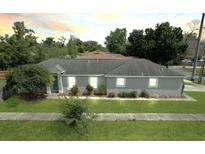 Charming single-story home featuring a well-manicured lawn and a quaint, inviting facade at 1833 Courtland St, Orlando, FL 32804
