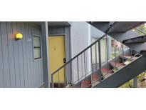 A welcoming entrance door of a unit with stairs leading to the upper floors at 2408 Lemon Tree Ln # C, Orlando, FL 32839