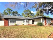 Charming single-story home with a well-maintained lawn and mature trees offering great curb appeal at 5704 Sw 108Th St, Ocala, FL 34476