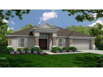 Charming single-story home featuring stone accents, a neatly manicured lawn, and a two car garage at 566 Gandy Cemetary Rd, Bartow, FL 33830