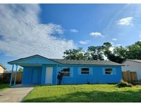 Charming single-story home features a neatly maintained lawn and welcoming curb appeal at 5390 Botany Ct, Orlando, FL 32811