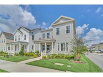 Two-story Craftsman home with front porch and landscaped lawn at 7401 Levee Ln, Celebration, FL 34747