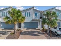 Charming two-story townhome features an attached garage, modern architecture, and well-maintained landscaping at 3359 Bellezza Ct, Kissimmee, FL 34746