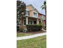 Two-story house with neutral siding, shutters, and landscaping at 10114 Madison Banks St, Orlando, FL 32827