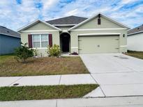 Charming single-story home with a well-manicured lawn and inviting curb appeal in a quiet neighborhood at 191 Emanuelle Dr, Winter Haven, FL 33884