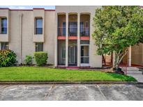 Charming condo featuring three archways and lush green lawn for a inviting curb appeal at 544 Orange Dr # 10, Altamonte Springs, FL 32701